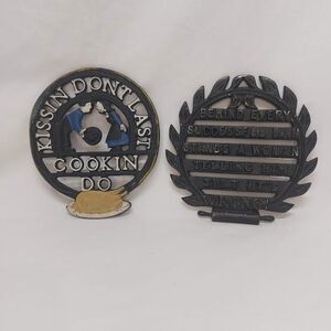 2 Vintage Cast Iron Trivets Decor Kitsch Quips "Kissin Dont Last Cookin Do"